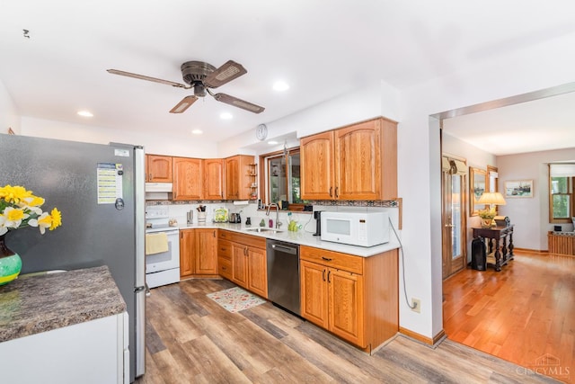 1107 Covedale Ave, Cincinnati, OH 45238 - kitchen featuring stainless steel appliances, a ceiling fan, light wood-style flooring, under cabinet range hood, and recessed lighting