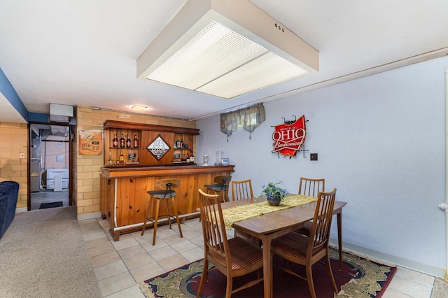 1107 Covedale Ave, Cincinnati, OH 45238 - dining area with a bar and light tile patterned flooring