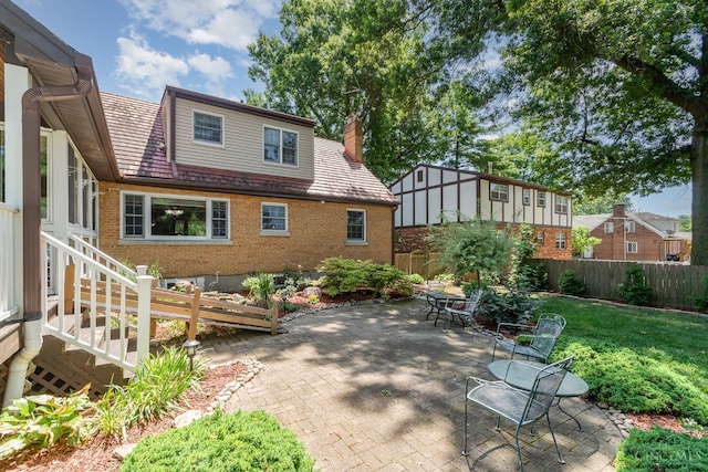 1107 Covedale Ave, Cincinnati, OH 45238 - fenced backyard with a patio area and outdoor dining space