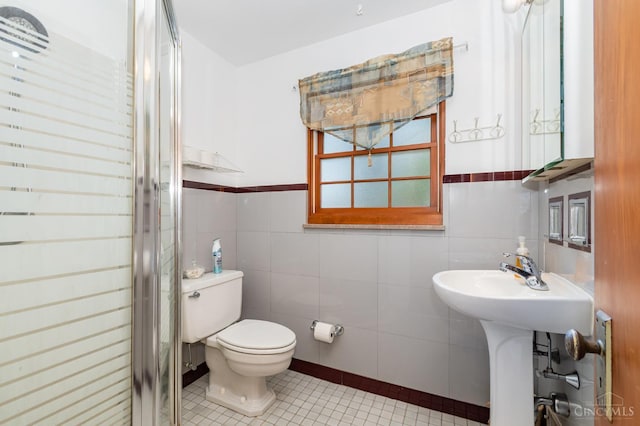 1107 Covedale Ave, Cincinnati, OH 45238 - full bath with tile patterned floors, a shower stall, tile walls, and wainscoting