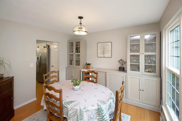 6711 Bayberry Ct, Hamilton Twp, OH 45039 - dining space with light wood-style floors