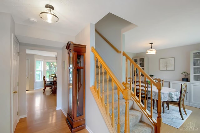 6711 Bayberry Ct, Hamilton Twp, OH 45039 - stairway with wood finished floors and baseboards