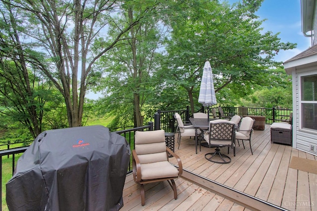 6711 Bayberry Ct, Hamilton Twp, OH 45039 - wooden deck featuring outdoor dining space, a grill, and view of wooded area