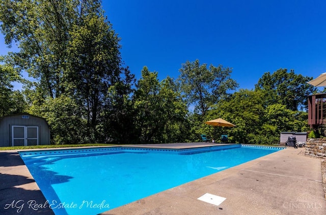 5817 Countryview Ter, Delhi Twp, OH 45233 - outdoor pool featuring a storage unit and a patio area