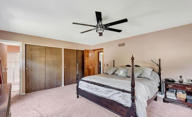 5817 Countryview Ter, Delhi Twp, OH 45233 - carpeted bedroom featuring two closets, a ceiling fan, and connected bathroom