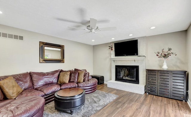 5817 Countryview Ter, Delhi Twp, OH 45233 - living area with ceiling fan, wood finished floors, a brick fireplace, and recessed lighting