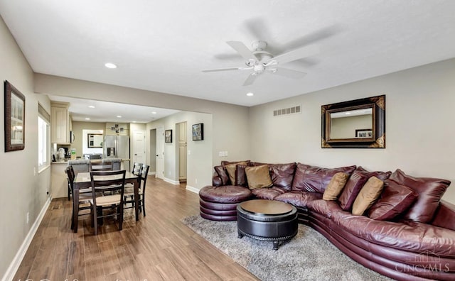 5817 Countryview Ter, Delhi Twp, OH 45233 - living area with wood finished floors, a ceiling fan, and recessed lighting