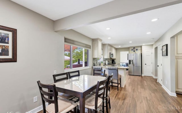 5817 Countryview Ter, Delhi Twp, OH 45233 - dining area with recessed lighting, light wood finished floors, and beamed ceiling