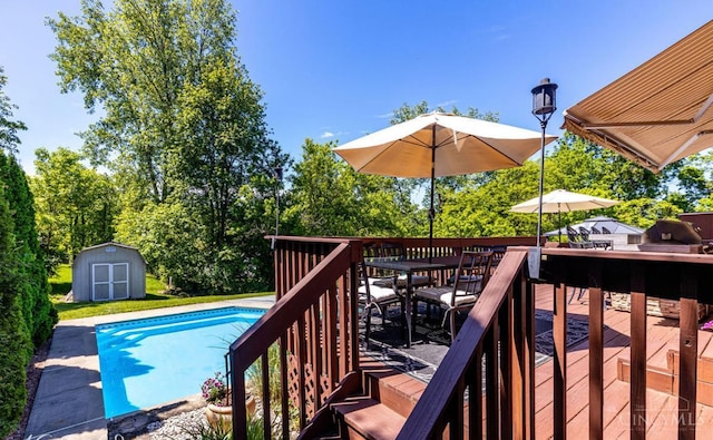5817 Countryview Ter, Delhi Twp, OH 45233 - wooden deck with a storage unit, an outdoor pool, and outdoor dining space