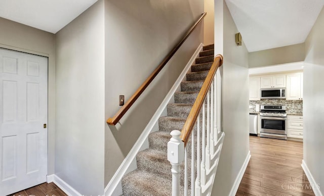 5817 Countryview Ter, Delhi Twp, OH 45233 - stairway with wood finished floors and baseboards