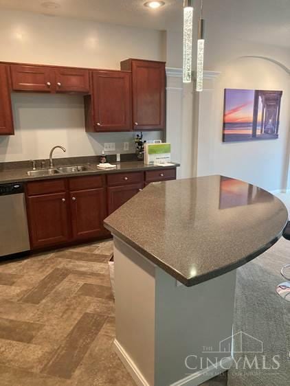 9530 Greenery Ct, Deerfield Twp, OH 45140 - kitchen featuring dark countertops, dishwasher, a center island, and pendant lighting