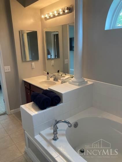 9530 Greenery Ct, Deerfield Twp, OH 45140 - full bathroom with a bath, vanity, tile patterned flooring, and ornate columns