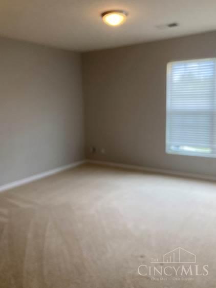 9530 Greenery Ct, Deerfield Twp, OH 45140 - empty room featuring baseboards and carpet flooring