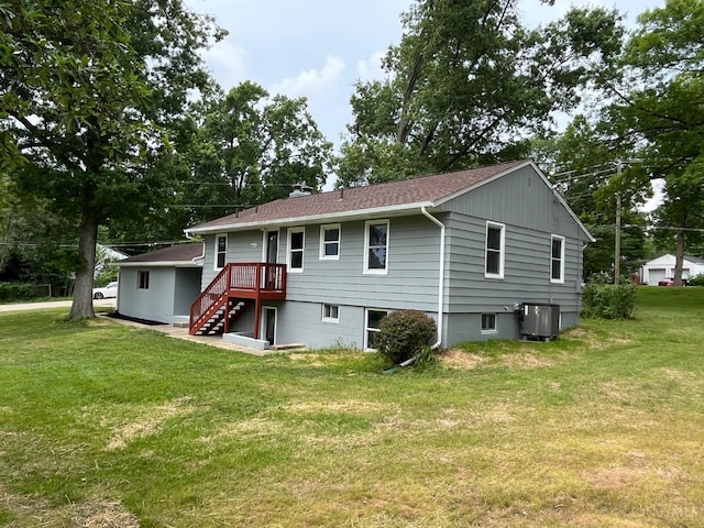 2035 Miles Rd, Cincinnati, OH 45231 - back of house featuring a yard, stairway, and roof with shingles
