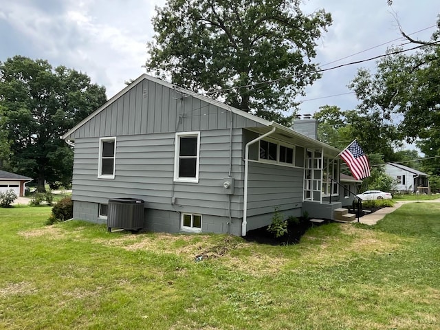 2035 Miles Rd, Cincinnati, OH 45231 - view of home's exterior with a yard and a chimney