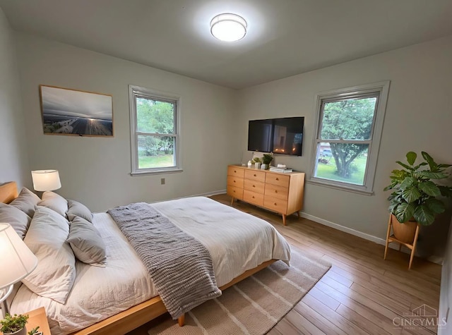 2035 Miles Rd, Cincinnati, OH 45231 - bedroom featuring baseboards and light wood-style flooring