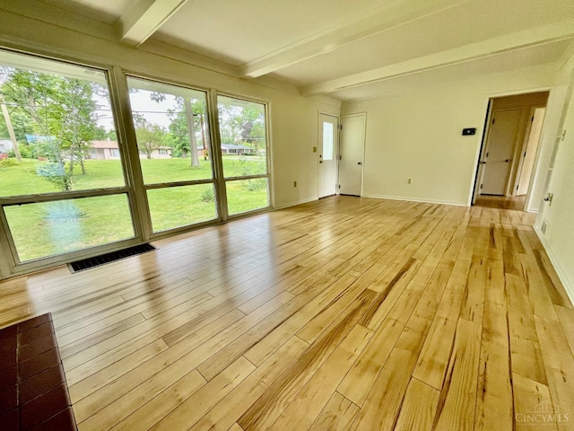 2035 Miles Rd, Cincinnati, OH 45231 - empty room featuring beam ceiling, light wood-type flooring, and plenty of natural light