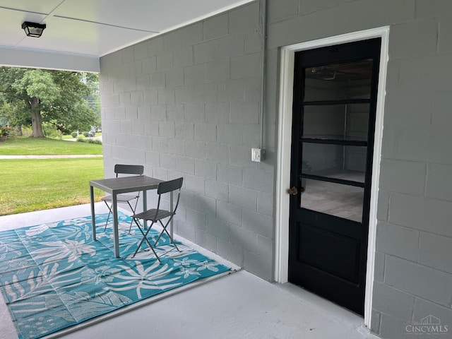 2035 Miles Rd, Cincinnati, OH 45231 - doorway to property with concrete block siding and a lawn