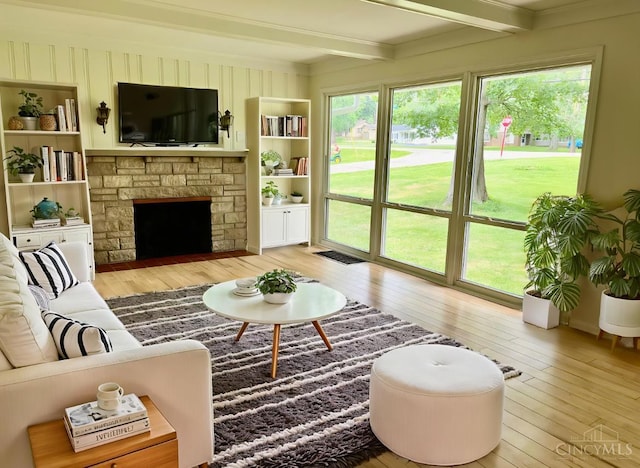 2035 Miles Rd, Cincinnati, OH 45231 - living area featuring hardwood / wood-style flooring, beamed ceiling, and a fireplace