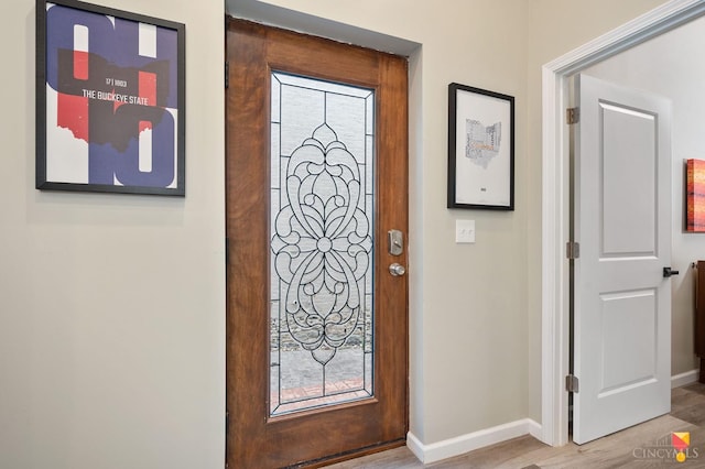 2711 Price Ave, Cincinnati, OH 45204 - entryway with baseboards and light wood finished floors
