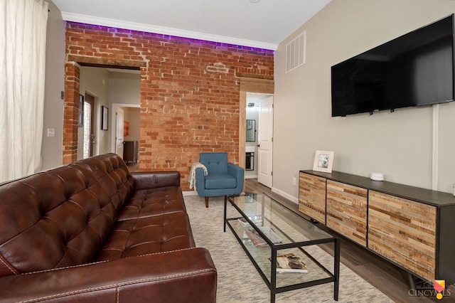 2711 Price Ave, Cincinnati, OH 45204 - living area featuring brick wall and wood finished floors
