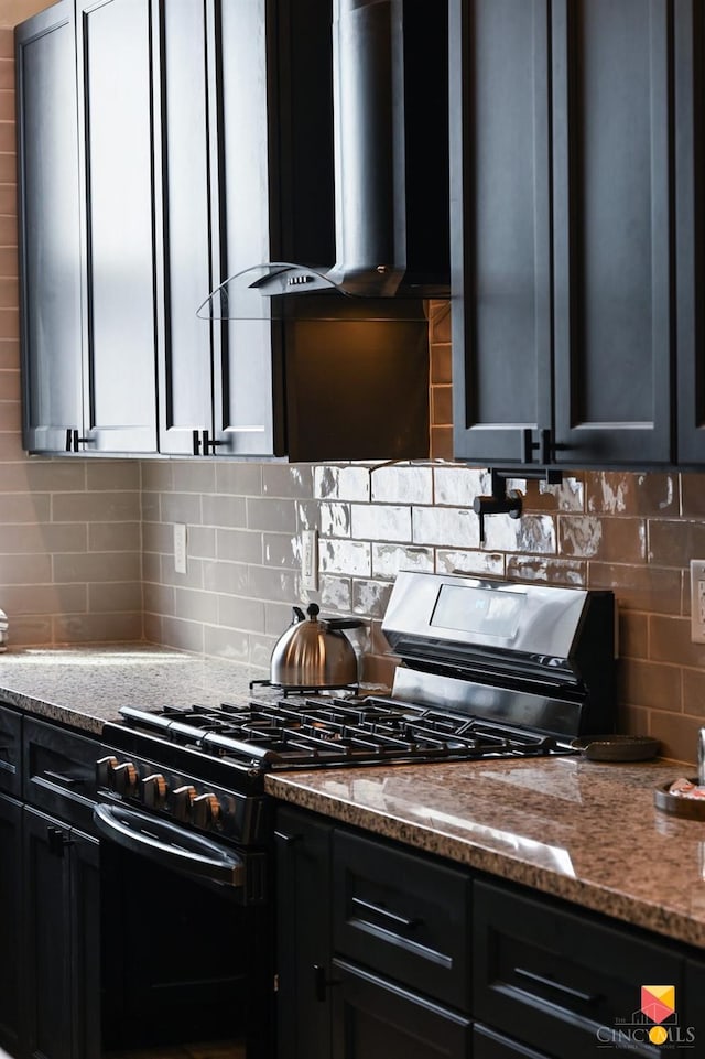 2711 Price Ave, Cincinnati, OH 45204 - kitchen with range with gas stovetop, range hood, light stone countertops, and tasteful backsplash