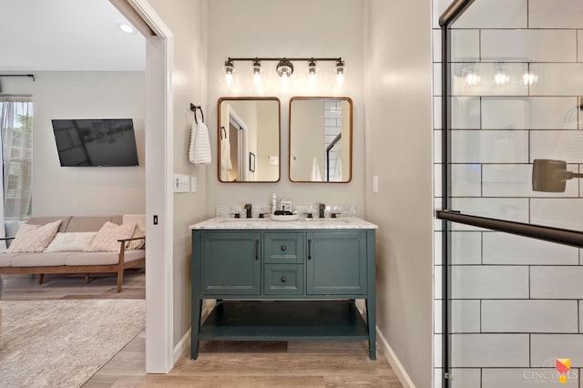 2711 Price Ave, Cincinnati, OH 45204 - full bathroom featuring wood finished floors and double vanity