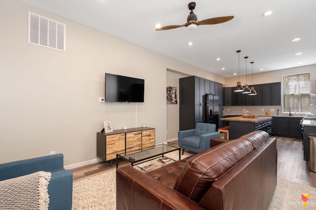 2711 Price Ave, Cincinnati, OH 45204 - living area with light wood-style floors, recessed lighting, and a ceiling fan