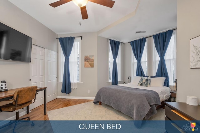 2711 Price Ave, Cincinnati, OH 45204 - bedroom with wood finished floors, a desk, a ceiling fan, and a closet