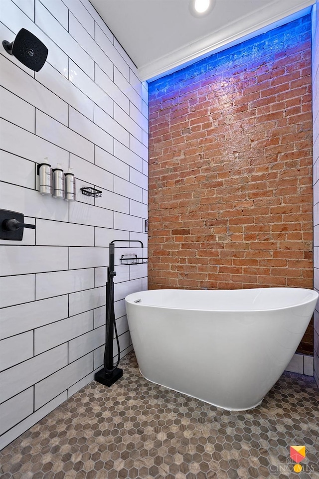2711 Price Ave, Cincinnati, OH 45204 - bathroom with brick wall and a freestanding tub