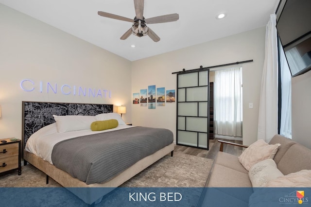 2711 Price Ave, Cincinnati, OH 45204 - bedroom with recessed lighting, wood finished floors, a ceiling fan, and a barn door