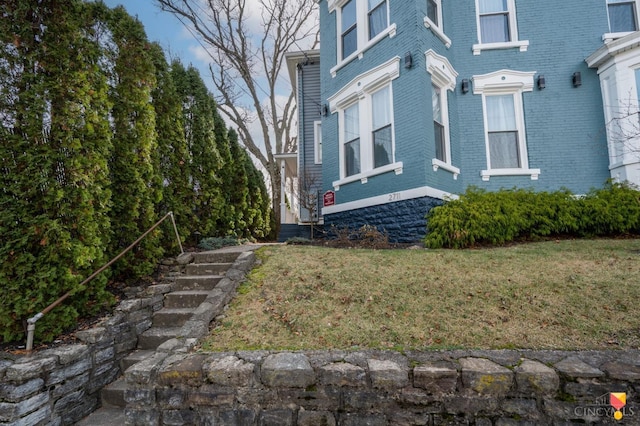 2711 Price Ave, Cincinnati, OH 45204 - view of side of property with brick siding and a yard