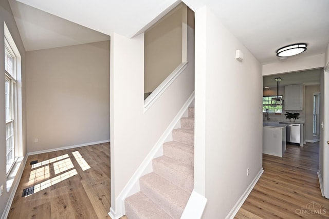 1055 Valley Wood Dr, Union Twp, OH 45103 - staircase with wood finished floors and baseboards