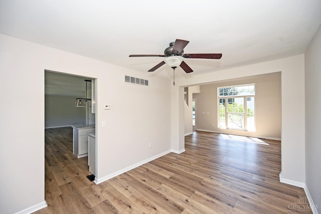 1055 Valley Wood Dr, Union Twp, OH 45103 - unfurnished room with light wood finished floors and ceiling fan