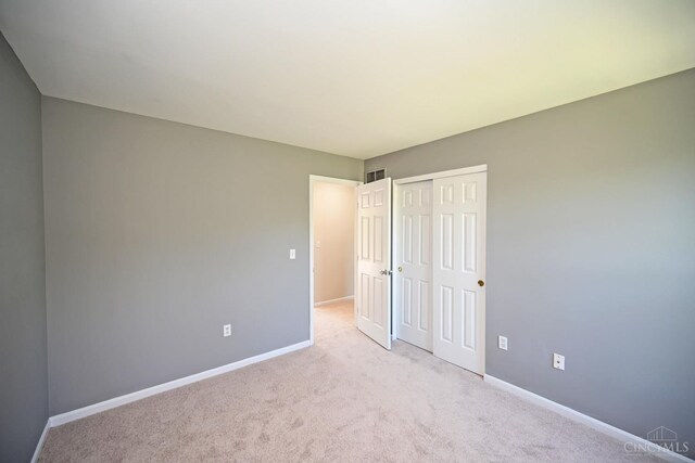 1055 Valley Wood Dr, Union Twp, OH 45103 - unfurnished bedroom with a closet and light colored carpet