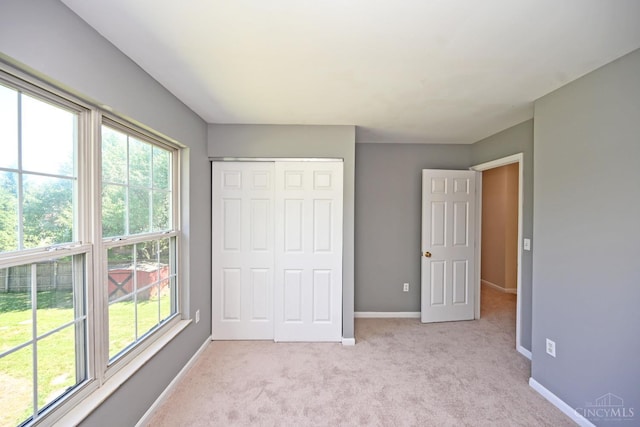 1055 Valley Wood Dr, Union Twp, OH 45103 - unfurnished bedroom with light colored carpet and a closet
