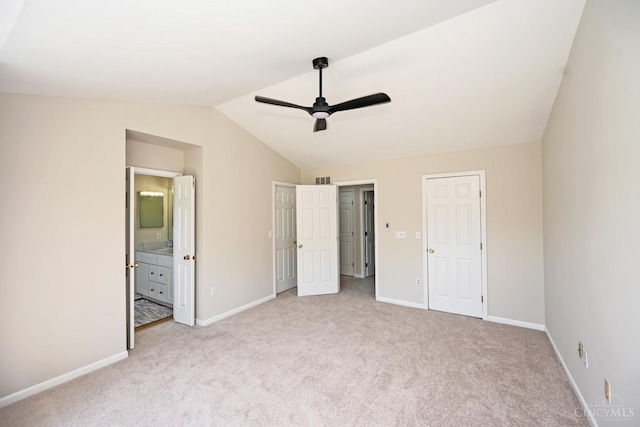 1055 Valley Wood Dr, Union Twp, OH 45103 - unfurnished bedroom featuring carpet floors, vaulted ceiling, connected bathroom, and a ceiling fan
