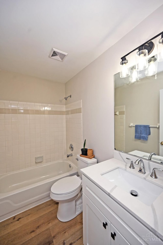 1055 Valley Wood Dr, Union Twp, OH 45103 - bathroom featuring wood finished floors, vanity, and shower / tub combination