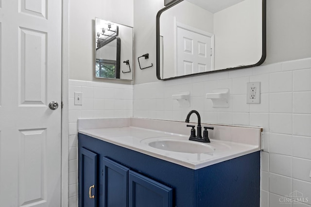 2016 Mistyhill Dr, Springfield Twp, OH 45240 - bathroom featuring tile walls, vanity, and a wainscoted wall