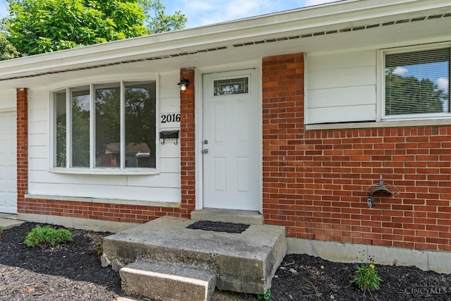 2016 Mistyhill Dr, Springfield Twp, OH 45240 - entrance to property featuring brick siding and an attached garage