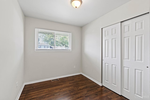 2016 Mistyhill Dr, Springfield Twp, OH 45240 - unfurnished bedroom featuring a closet and dark wood-type flooring