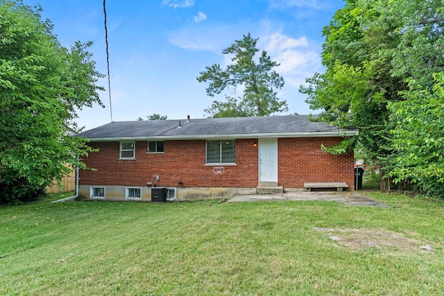 2016 Mistyhill Dr, Springfield Twp, OH 45240 - back of property featuring a lawn, brick siding, and entry steps