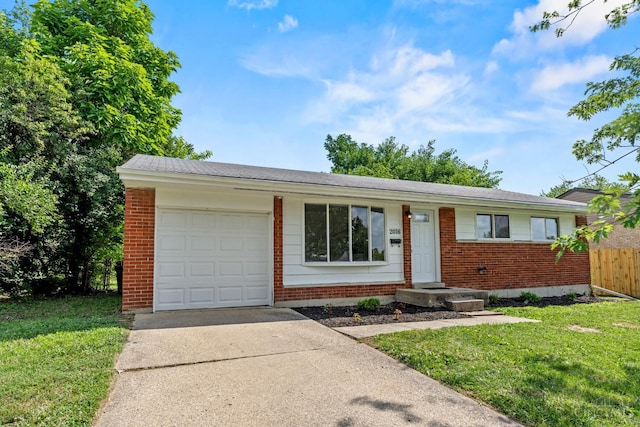 2016 Mistyhill Dr, Springfield Twp, OH 45240 - ranch-style house with brick siding, concrete driveway, and an attached garage