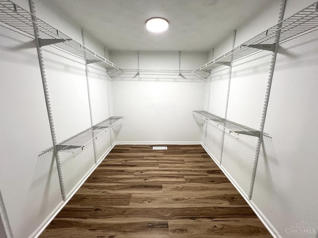 176 Lakeview Dr, Monroe, OH 45044 - walk in closet featuring wood finished floors