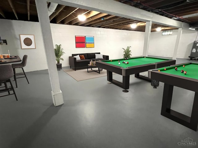 176 Lakeview Dr, Monroe, OH 45044 - recreation room with finished concrete floors, pool table, and concrete block wall