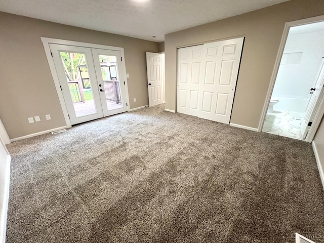 176 Lakeview Dr, Monroe, OH 45044 - unfurnished bedroom featuring french doors, access to outside, connected bathroom, a closet, and carpet