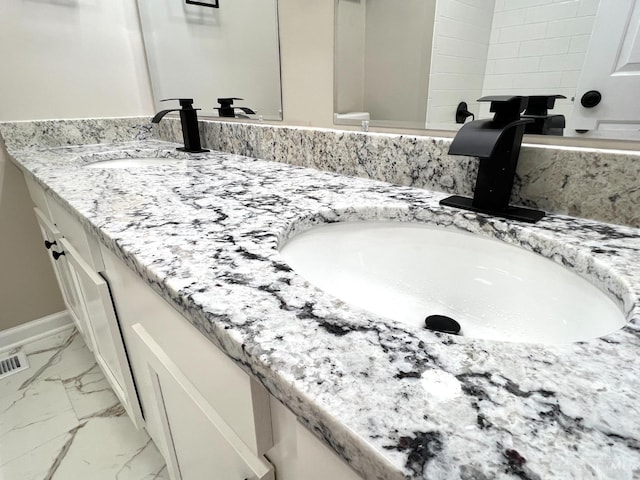 176 Lakeview Dr, Monroe, OH 45044 - full bathroom featuring double vanity and marble finish floors