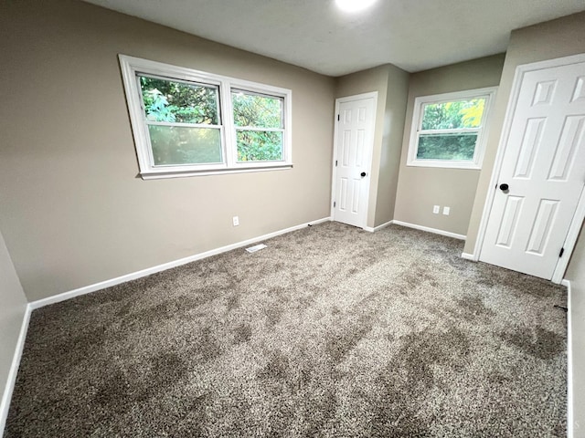 176 Lakeview Dr, Monroe, OH 45044 - unfurnished bedroom with baseboards and carpet flooring