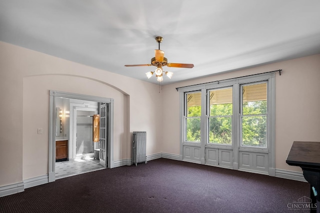 2153 Sinton Ave, Cincinnati, OH 45206 - unfurnished room with dark carpet, radiator, and ceiling fan