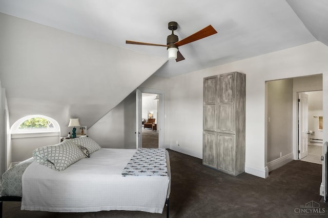 2153 Sinton Ave, Cincinnati, OH 45206 - bedroom with vaulted ceiling, dark colored carpet, ceiling fan, baseboard heating, and ensuite bath